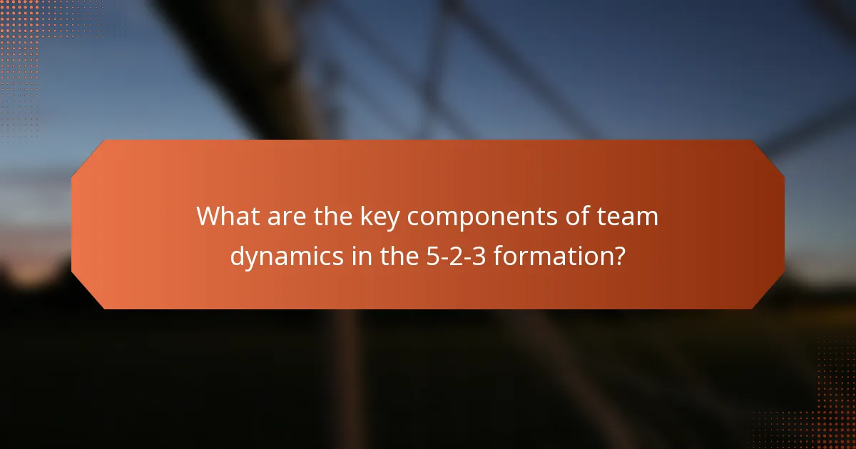 What are the key components of team dynamics in the 5-2-3 formation?